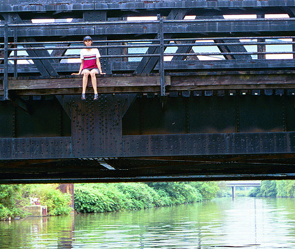 Ayat Osman on a bridge over the river