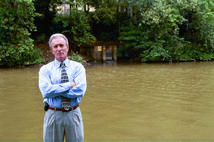 John Schombert in front of the river