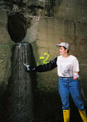 Kathy Knauer collecting a water sample