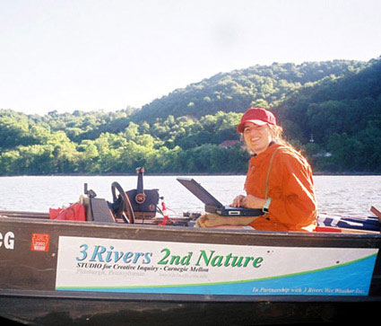 Maria Barron doing field work on the river