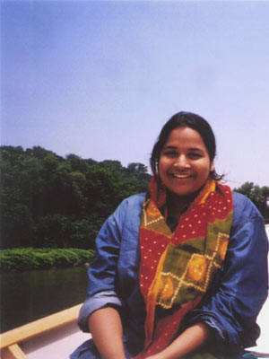 Priya Krishna on a boat in a river