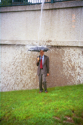 Richard Pinkham under an umbrella